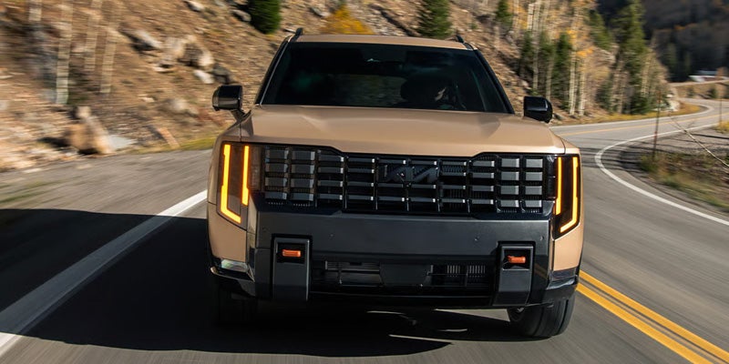 2027 Kia Telluride front exterior driving on mountain road