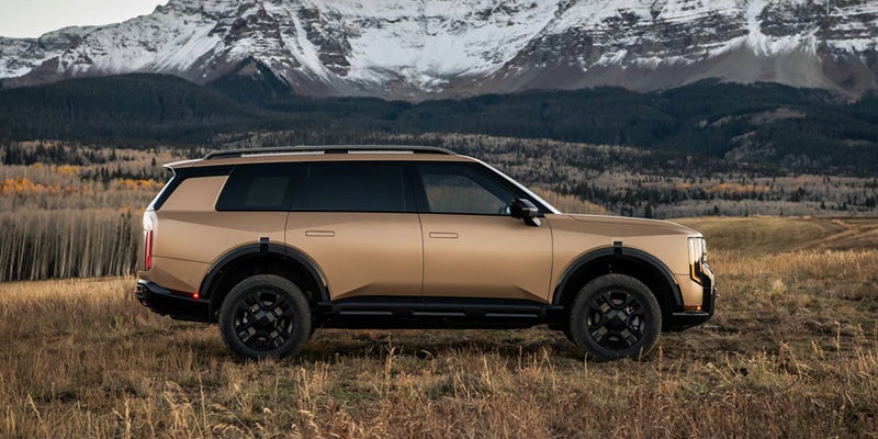 2027 Kia Telluride SUV side profile with mountain scenery